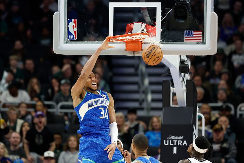 MILWAUKEE, WISCONSIN - MARCH 21: Giannis Antetokounmpo #34 of the Milwaukee Bucks scores on a dunk in the fourth quarter against the Brooklyn Nets at Fiserv Forum on March 21, 2024 in Milwaukee, Wisconsin. NOTE TO USER: User expressly acknowledges and agrees that, by downloading and or using this photograph, User is consenting to the terms and conditions of the Getty Images License Agreement. (Photo by John Fisher/Getty Images)