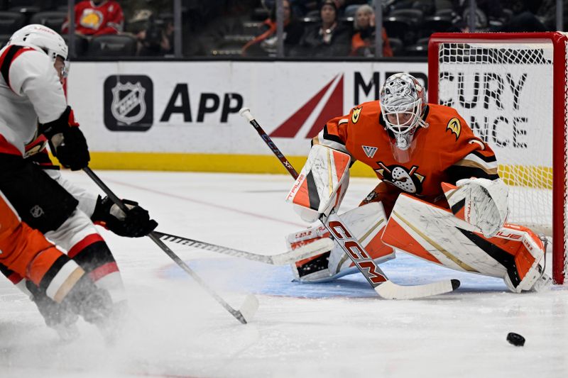 Dec 1, 2024; Anaheim, California, USA; Ottawa Senators left wing Noah Gregor (73) shot goes wide of Anaheim Ducks goaltender Lukas Dostal (1) at Honda Center. Mandatory Credit: Alex Gallardo-Imagn Images