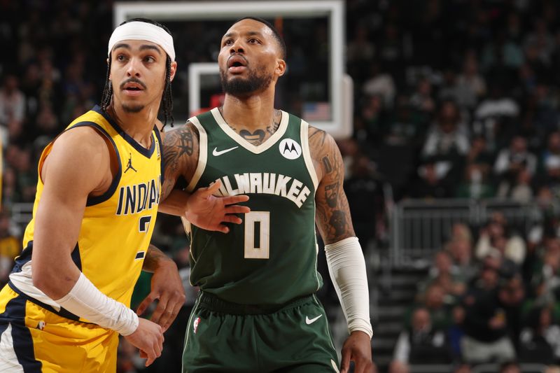 MILWAUKEE, WI - APRIL 21: Andrew Nembhard #2 of the Indiana Pacers and Damian Lillard #0 of the Milwaukee Bucks wait for a rebound during the game during Round 1 Game 1 of the 2024 NBA Playoffs on April 21, 2024 at the Fiserv Forum Center in Milwaukee, Wisconsin. NOTE TO USER: User expressly acknowledges and agrees that, by downloading and or using this Photograph, user is consenting to the terms and conditions of the Getty Images License Agreement. Mandatory Copyright Notice: Copyright 2024 NBAE (Photo by Gary Dineen/NBAE via Getty Images).