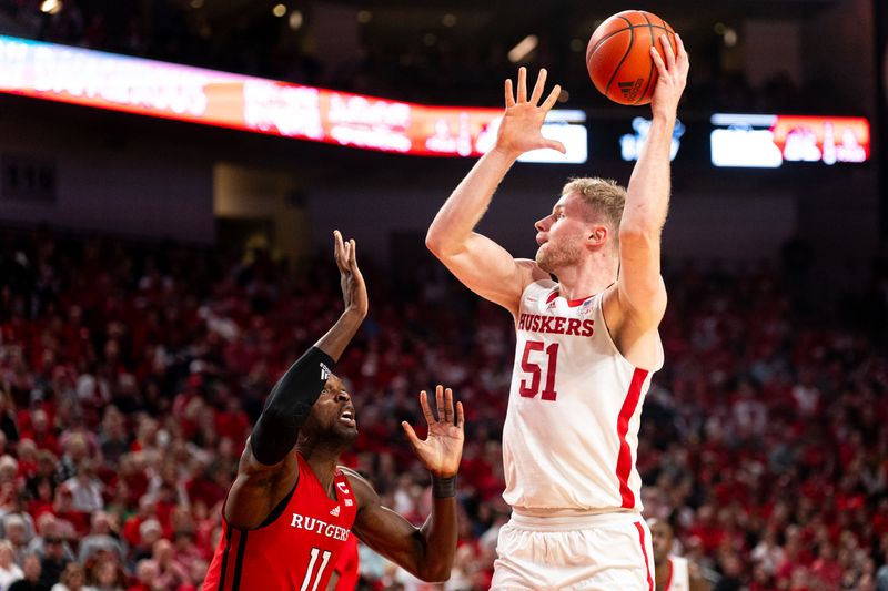 Mar 3, 2024; Lincoln, Nebraska, USA; Nebraska Cornhuskers forward Rienk Mast (51) shoots the ball against Rutgers Scarlet Knights center Clifford Omoruyi (11) during the first half at Pinnacle Bank Arena. Mandatory Credit: Dylan Widger-USA TODAY Sports