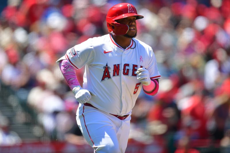 May 12, 2024; Anaheim, California, USA; Los Angeles Angels designated hitter Willie Calhoun (5) runs after hitting a single against the Kansas City Royals during the fourth inning at Angel Stadium. Mandatory Credit: Gary A. Vasquez-USA TODAY Sports