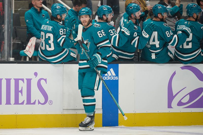 Nov 16, 2023; San Jose, California, USA; San Jose Sharks left wing Mike Hoffman (68) shakes hands with his teammates on the bench after scoring a goal against the St. Louis Blues during the first period at SAP Center at San Jose. Mandatory Credit: Robert Edwards-USA TODAY Sports