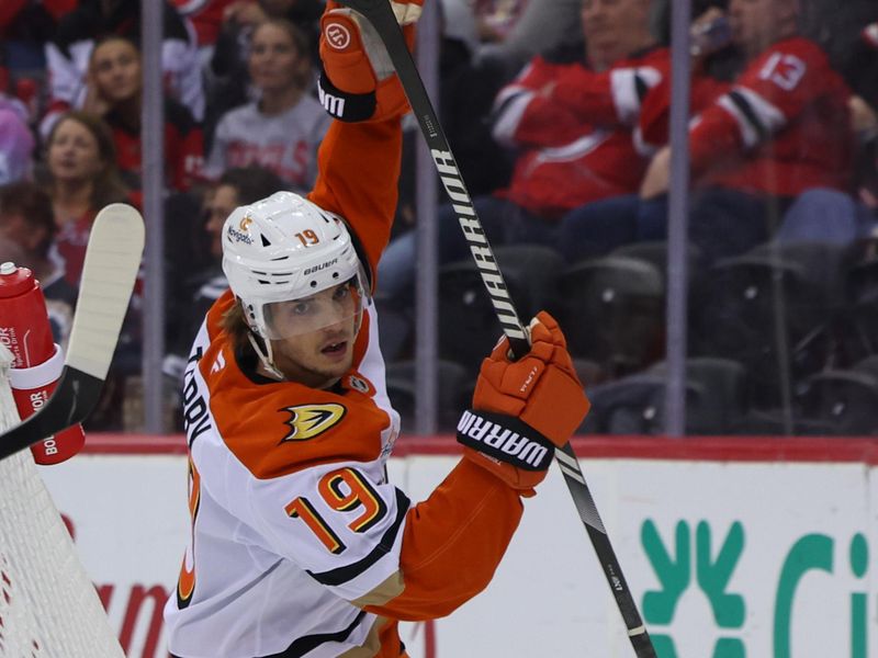 Oct 27, 2024; Newark, New Jersey, USA; Anaheim Ducks right wing Troy Terry (19) celebrates a goal by Anaheim Ducks left wing Brock McGinn (26) (not shown) against the New Jersey Devils during the first period at Prudential Center. Mandatory Credit: Ed Mulholland-Imagn Images