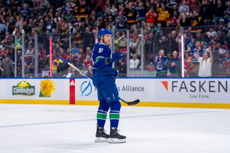 Mar 21, 2024; Vancouver, British Columbia, CAN; Vancouver Canucks defenseman Nikita Zadorov (91) celebrates his first goal of the game against the Montreal Canadiens in the first period at Rogers Arena. Mandatory Credit: Bob Frid-USA TODAY Sports