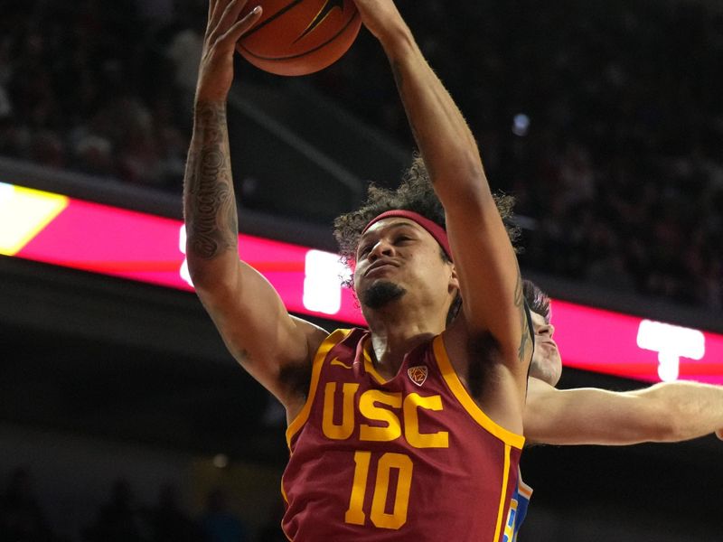 Jan 27, 2024; Los Angeles, California, USA; Southern California Trojans forward DJ Rodman (10) rebounds the ball against the UCLA Bruins in the first half at Galen Center. Mandatory Credit: Kirby Lee-USA TODAY Sports