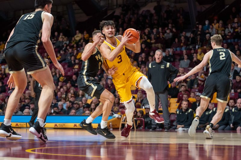 Jan 19, 2023; Minneapolis, Minnesota, USA; Minnesota Golden Gophers forward Dawson Garcia (3) is defended by Purdue Boilermakers forward Mason Gillis (0) in the first half at Williams Arena. Mandatory Credit: Matt Blewett-USA TODAY Sports