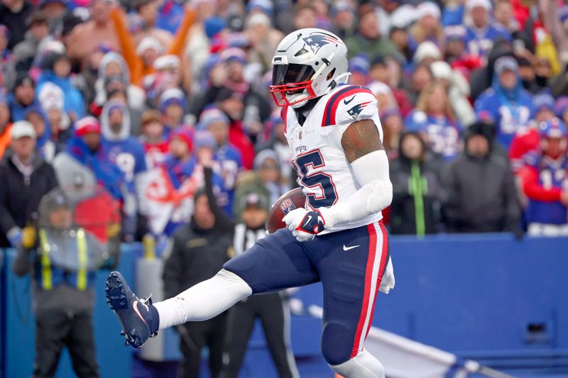 New England Patriots running back Ezekiel Elliott (15) celebrates after scoring during the second half of an NFL football game against the Buffalo Bills in Orchard Park, N.Y., Sunday, Dec. 31, 2023. (AP Photo/Jeffrey T. Barnes )