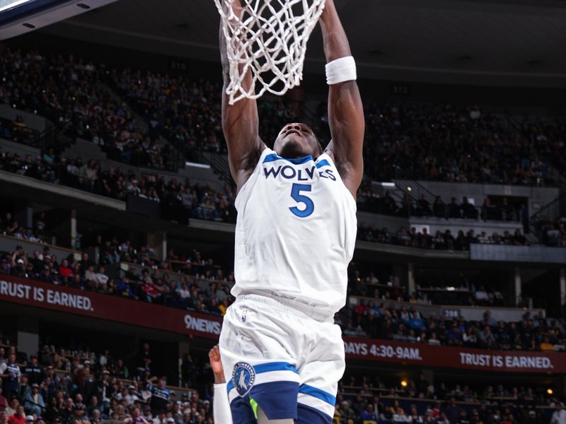 DENVER, CO - APRIL 10: Anthony Edwards #5 of the Minnesota Timberwolves dunks the ball during the game against the Denver Nuggets on April 10, 2024 at the Ball Arena in Denver, Colorado. NOTE TO USER: User expressly acknowledges and agrees that, by downloading and/or using this Photograph, user is consenting to the terms and conditions of the Getty Images License Agreement. Mandatory Copyright Notice: Copyright 2024 NBAE (Photo by Garrett Ellwood/NBAE via Getty Images)