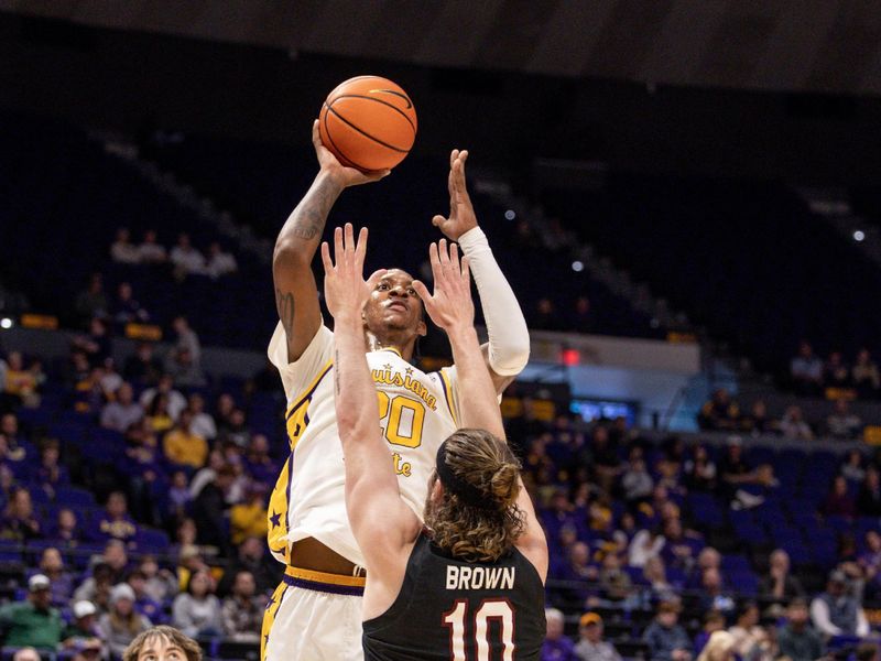 Feb 18, 2023; Baton Rouge, Louisiana, USA; LSU Tigers forward Derek Fountain (20) shoots a jump shot against South Carolina Gamecocks forward Hayden Brown (10) at Pete Maravich Assembly Center. Mandatory Credit: Stephen Lew-USA TODAY Sports