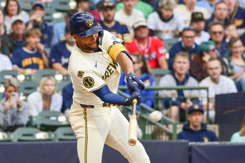 Jun 10, 2025; Milwaukee, Wisconsin, USA; Milwaukee Brewers center fielder Jackson Chourio (11) hits a two run home run in the third inning against the Atlanta Braves at American Family Field. Mandatory Credit: Benny Sieu-Imagn Images