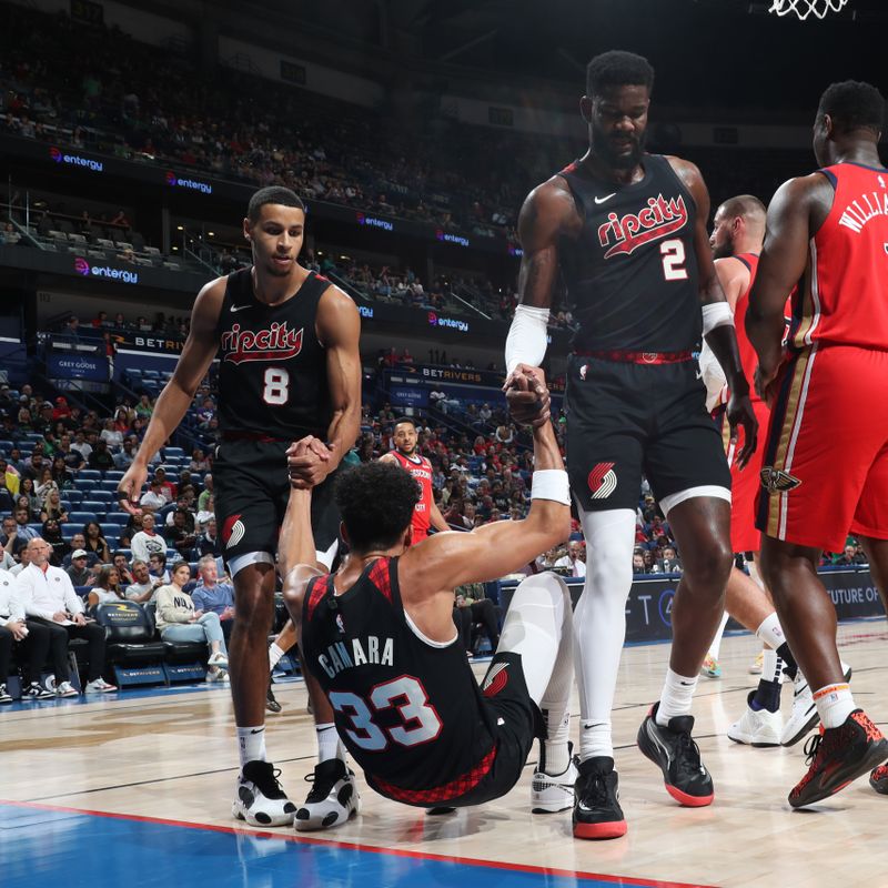 NEW ORLEANS, LA - MARCH 16: Toumani Camara #33 of the Portland Trail Blazers is helped up during the game against the New Orleans Pelicans on March 16, 2024 at the Smoothie King Center in New Orleans, Louisiana. NOTE TO USER: User expressly acknowledges and agrees that, by downloading and or using this Photograph, user is consenting to the terms and conditions of the Getty Images License Agreement. Mandatory Copyright Notice: Copyright 2024 NBAE (Photo by Layne Murdoch Jr./NBAE via Getty Images)