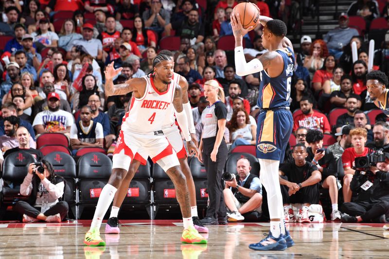 HOUSTON, TX - OCTOBER 15: Jalen Green #4 of the Houston Rockets plays defense during the game against the New Orleans Pelicans during a NBA preseason game on October 15, 2024 at the Toyota Center in Houston, Texas. NOTE TO USER: User expressly acknowledges and agrees that, by downloading and or using this photograph, User is consenting to the terms and conditions of the Getty Images License Agreement. Mandatory Copyright Notice: Copyright 2024 NBAE (Photo by Logan Riely/NBAE via Getty Images)