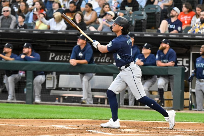 Jul 26, 2024; Chicago, Illinois, USA;  Seattle Mariners third base Josh Rojas (4) hits a three-run home run against the Chicago White Sox during the first inning at Guaranteed Rate Field. Mandatory Credit: Matt Marton-USA TODAY Sports