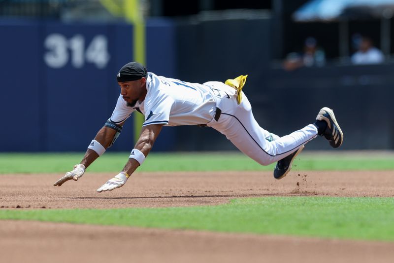 Sep 18, 2025; Tampa, Florida, USA; Tampa Bay Rays center fielder Chandler Simpson (14) slides into second base on a double against the Toronto Blue Jays in the first inning at George M. Steinbrenner Field. Mandatory Credit: Nathan Ray Seebeck-Imagn Images