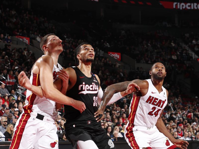 PORTLAND, OR - JANUARY 11: Toumani Camara #33 of the Portland Trail Blazers boxes out during the game against the Miami Heat on January 11, 2025 at the Moda Center Arena in Portland, Oregon. NOTE TO USER: User expressly acknowledges and agrees that, by downloading and or using this photograph, user is consenting to the terms and conditions of the Getty Images License Agreement. Mandatory Copyright Notice: Copyright 2025 NBAE (Photo by Cameron Browne/NBAE via Getty Images)