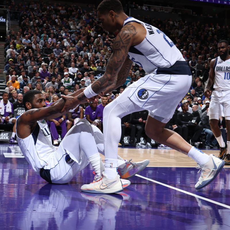 SALT LAKE CITY, UT - MARCH 25: Kyrie Irving #11 of the Dallas Mavericks helped up bt PJ Washington #25 of the Dallas Mavericks during the game against the Utah Jazz on March 25, 2024 at Delta Center in Salt Lake City, Utah. NOTE TO USER: User expressly acknowledges and agrees that, by downloading and or using this Photograph, User is consenting to the terms and conditions of the Getty Images License Agreement. Mandatory Copyright Notice: Copyright 2024 NBAE (Photo by Melissa Majchrzak/NBAE via Getty Images)