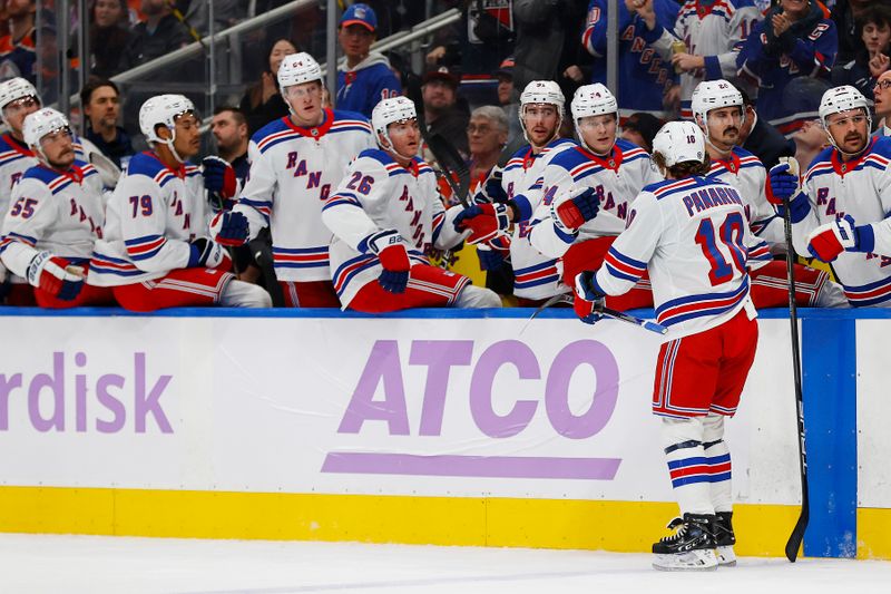 Nov 23, 2024; Edmonton, Alberta, CAN; The New York Rangers celebrate a goal scored by forward Artemi Panarin (10) during the second period against the Edmonton Oilers at Rogers Place. Mandatory Credit: Perry Nelson-Imagn Images