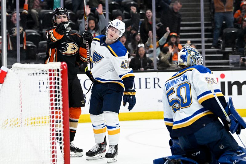 Mar 25, 2023; Anaheim, California, USA; Anaheim Ducks center Nikita Nesterenko (62) celebrates in front of St. Louis Blues defenseman Torey Krug (47) after scoring a goal during first period at Honda Center. Mandatory Credit: Kelvin Kuo-USA TODAY Sports