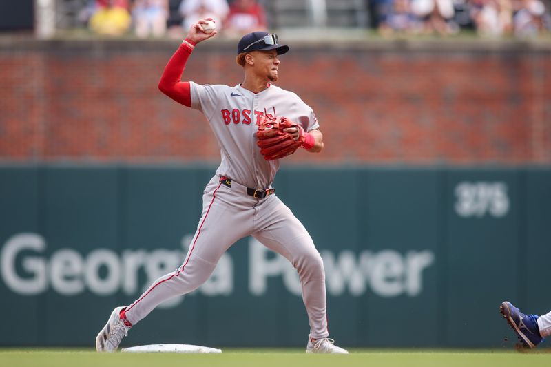 May 31, 2025; Atlanta, Georgia, USA; Boston Red Sox second baseman Kristian Campbell (28) turns a double play against the Atlanta Braves in the first inning at Truist Park. Mandatory Credit: Brett Davis-Imagn Images