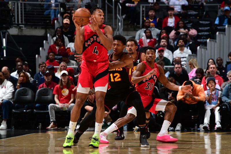 ATLANTA, GA - February 23:  Scottie Barnes #4 of the Toronto Raptors handles the ball during the game against the Atlanta Hawks on February 23, 2024 at State Farm Arena in Atlanta, Georgia.  NOTE TO USER: User expressly acknowledges and agrees that, by downloading and/or using this Photograph, user is consenting to the terms and conditions of the Getty Images License Agreement. Mandatory Copyright Notice: Copyright 2024 NBAE (Photo by Scott Cunningham/NBAE via Getty Images)