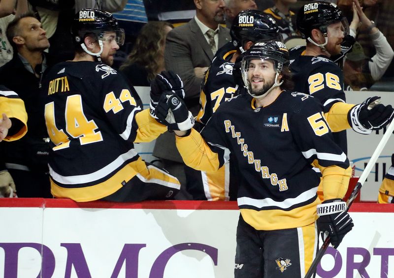 Apr 6, 2023; Pittsburgh, Pennsylvania, USA; Pittsburgh Penguins defenseman Kris Letang (58) celebrates his goal with the Pens bench against the Minnesota Wild during the first period at PPG Paints Arena. Mandatory Credit: Charles LeClaire-USA TODAY Sports