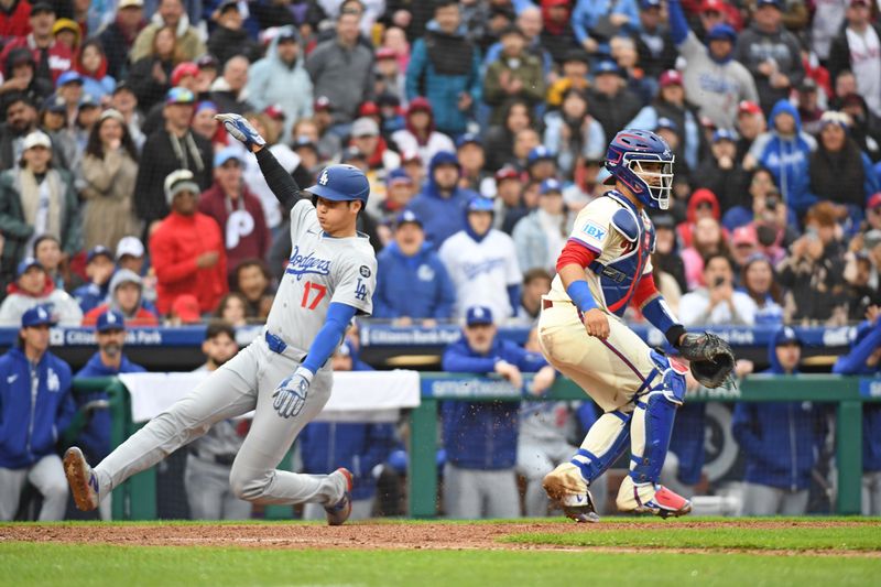 Apr 6, 2025; Philadelphia, Pennsylvania, USA; Los Angeles Dodgers two-way player Shohei Ohtani (17) slides safely into home as Philadelphia Phillies catcher Rafael Marchán (13) waits for the throw during the seventh inning at Citizens Bank Park. Mandatory Credit: Eric Hartline-Imagn Images