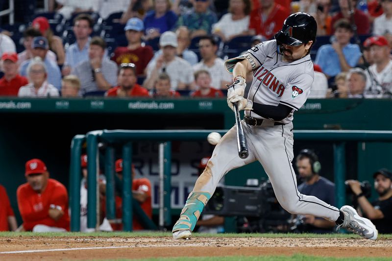 Jun 18, 2024; Washington, District of Columbia, USA; Arizona Diamondbacks outfielder Corbin Carroll (7) singles against the Washington Nationals during the ninth inning at Nationals Park. Mandatory Credit: Geoff Burke-USA TODAY Sports