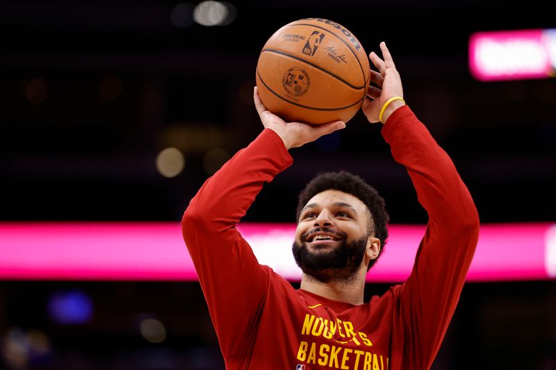 DENVER, COLORADO - FEBRUARY 28: Jamal Murray #27 of the Denver Nuggets warms up before the game against the Sacramento Kings at Ball Arena on February 28, 2024 in Denver, Colorado. (Photo by Brendall O'Banon/Clarkson Creative/Getty Images)