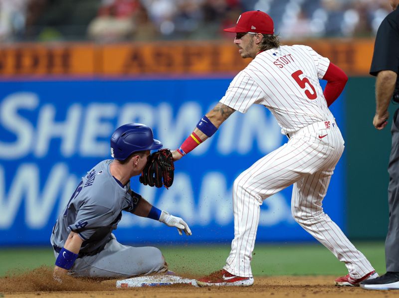 Jul 9, 2024; Philadelphia, Pennsylvania, USA; Philadelphia Phillies second base Bryson Stott (5) tags out Los Angeles Dodgers catcher Will Smith (16) as he tries to advance a single during the ninth inning at Citizens Bank Park. Mandatory Credit: Bill Streicher-USA TODAY Sports