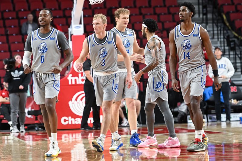 Dec 20, 2022; Lincoln, Nebraska, USA;  Drake Bulldogs guards D.J. Wilkins (0), Tucker DeVries (12), Garrett Sturtz (3), Sardaar Calhoun (14)  and Roman Penn (1) react to the win against the Mississippi State Bulldogs in the second half at Pinnacle Bank Arena. Mandatory Credit: Steven Branscombe-USA TODAY Sports