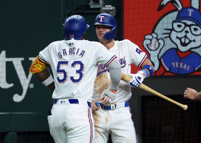 Sep 18, 2024; Arlington, Texas, USA;  Texas Rangers right fielder Adolis Garcia (53) celebrates with Texas Rangers third baseman Josh Jung (6) after hitting a two-run home run during the sixth inning against the Toronto Blue Jays at Globe Life Field. Mandatory Credit: Kevin Jairaj-Imagn Images