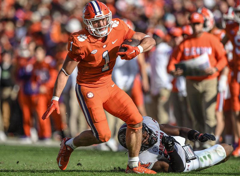 Nov 26, 2022; Clemson, SC, USA; Clemson running back Will Shipley (1) runs near South Carolina defensive back Nick Emmanwori (21) during the third quarter at Memorial Stadium in Clemson, South Carolina on Saturday, Nov. 26, 2022.    Mandatory Credit: Ken Ruinard-USA TODAY Sports