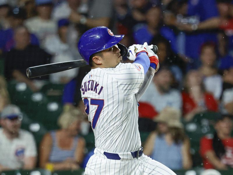 Aug 1, 2024; Chicago, Illinois, USA; Chicago Cubs outfielder Seiya Suzuki (27) hits a solo home run against the St. Louis Cardinals during the sixth inning at Wrigley Field. Mandatory Credit: Kamil Krzaczynski-USA TODAY Sports
