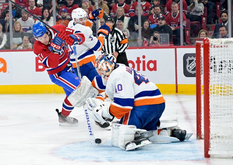 Jan 25, 2024; Montreal, Quebec, CAN; New York Islanders goalie Semyon Varlamov (40) stops Montreal Canadiens forward Josh Anderson (17) during the third period at the Bell Centre. Mandatory Credit: Eric Bolte-USA TODAY Sports