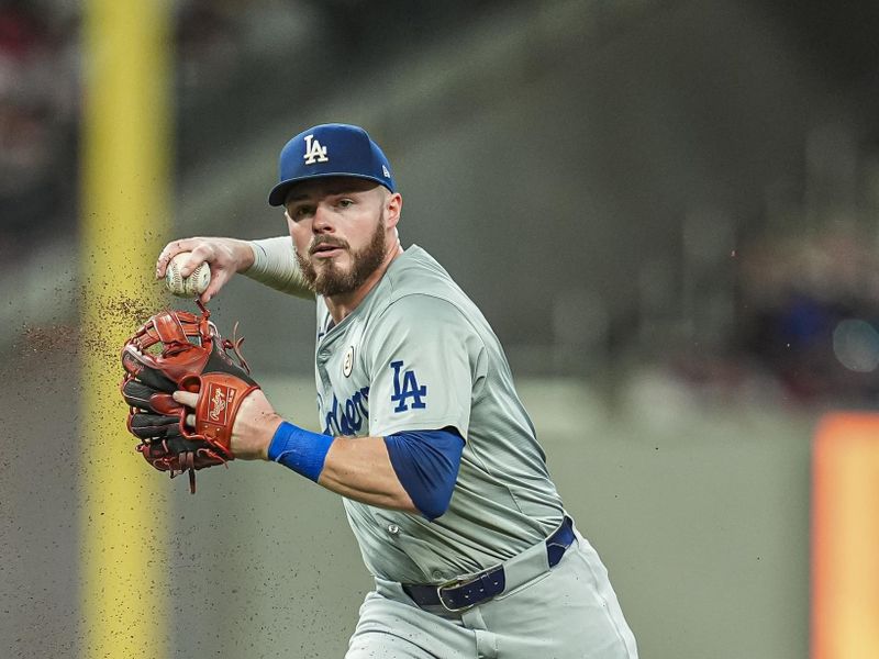 Sep 15, 2024; Cumberland, Georgia, USA; Los Angeles Dodgers second baseman Gavin Lux (9) throws out Atlanta Braves third baseman Gio Urshela (9) (not pictured) during the sixth inning at Truist Park. Mandatory Credit: Dale Zanine-Imagn Images