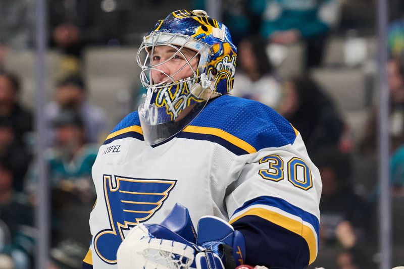 Apr 6, 2024; San Jose, California, USA; St. Louis Blues goaltender Joel Hofer (30) waits for play to resume against the San Jose Sharks during the overtime period at SAP Center at San Jose. Mandatory Credit: Robert Edwards-USA TODAY Sports