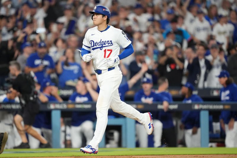 Oct 17, 2025; Los Angeles, California, USA; Los Angeles Dodgers two-way player Shohei Ohtani (17) runs after hitting a solo home run against the Milwaukee Brewers in the fourth inning during game four of the NLCS round for the 2025 MLB playoffs at Dodger Stadium. Mandatory Credit: Kirby Lee-Imagn Images