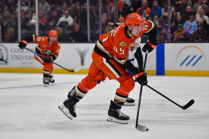 Dec 31, 2025; Anaheim, California, USA; Anaheim Ducks right wing Beckett Sennecke (45) shoots on goal against the Tampa Bay Lightning during the second period at Honda Center. Mandatory Credit: Gary A. Vasquez-Imagn Images