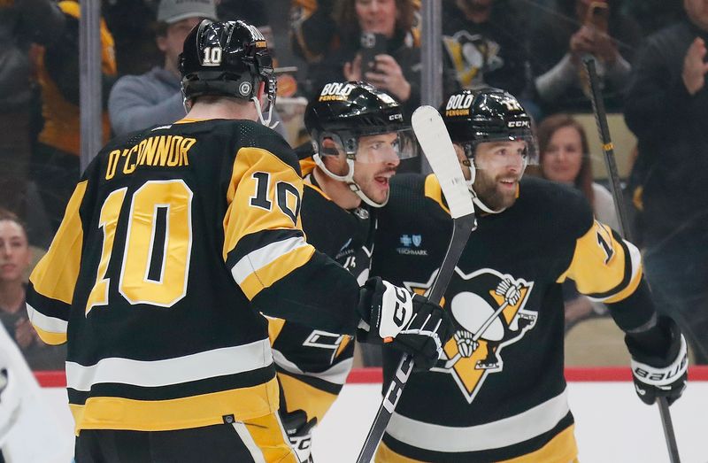 Apr 6, 2024; Pittsburgh, Pennsylvania, USA;  Pittsburgh Penguins center Sidney Crosby (middle) celebrates with left wing Drew O'Connor (10) and right wing Bryan Rust (17) after scoring a goal against the Tampa Bay Lightning during the first period at PPG Paints Arena. Mandatory Credit: Charles LeClaire-USA TODAY Sports