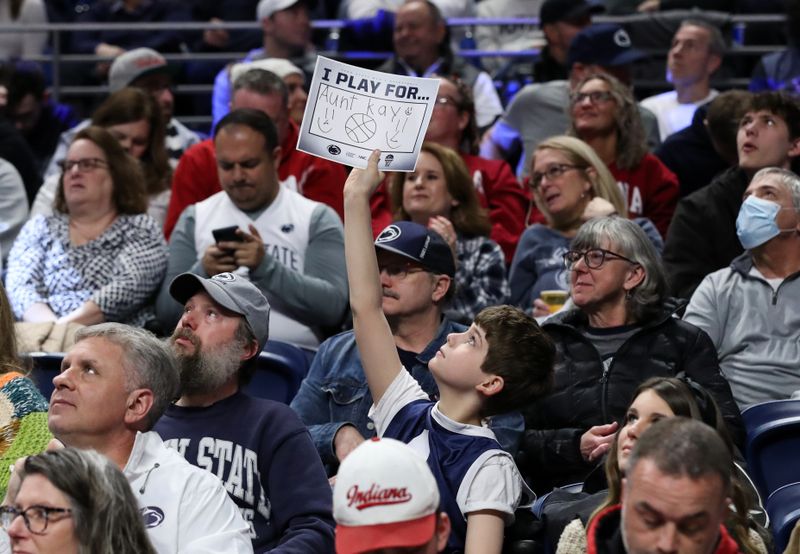 Feb 24, 2024; University Park, Pennsylvania, USA; A Penn State fan holds up a sign to recognize a loved one as part of the Coaches vs. Cancer game during the second half against the Indiana Hoosiers at Bryce Jordan Center. Penn State defeated Indiana 83-74. Mandatory Credit: Matthew O'Haren-USA TODAY Sports