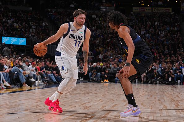 DENVER, CO - DECEMBER 18: Luka Doncic #77 of the Dallas Mavericks handles the ball during the game against the Denver Nuggets on December 18, 2023 at the Ball Arena in Denver, Colorado. NOTE TO USER: User expressly acknowledges and agrees that, by downloading and/or using this Photograph, user is consenting to the terms and conditions of the Getty Images License Agreement. Mandatory Copyright Notice: Copyright 2023 NBAE (Photo by Bart Young/NBAE via Getty Images)