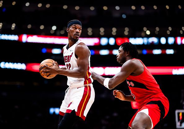 TORONTO, ON - DECEMBER 6: Jimmy Butler #22 of the Miami Heat is guarded by OG Anunoby #3 of the Toronto Raptors during the first half of their basketball game at the Scotiabank Arena on December 6, 2023 in Toronto, Ontario, Canada. NOTE TO USER: User expressly acknowledges and agrees that, by downloading and/or using this Photograph, user is consenting to the terms and conditions of the Getty Images License Agreement. (Photo by Mark Blinch/Getty Images)