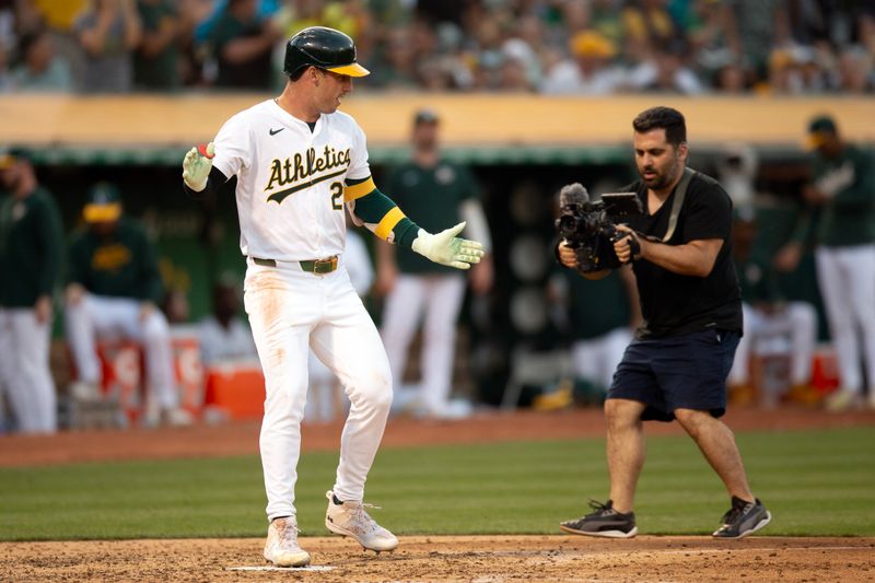 Jul 3, 2024; Oakland, California, USA; Oakland Athletics designated hitter Brent Rooker (25) celebrates his solo home run against the Los Angeles Angels during the sixth inning at Oakland-Alameda County Coliseum. Mandatory Credit: D. Ross Cameron-USA TODAY Sports