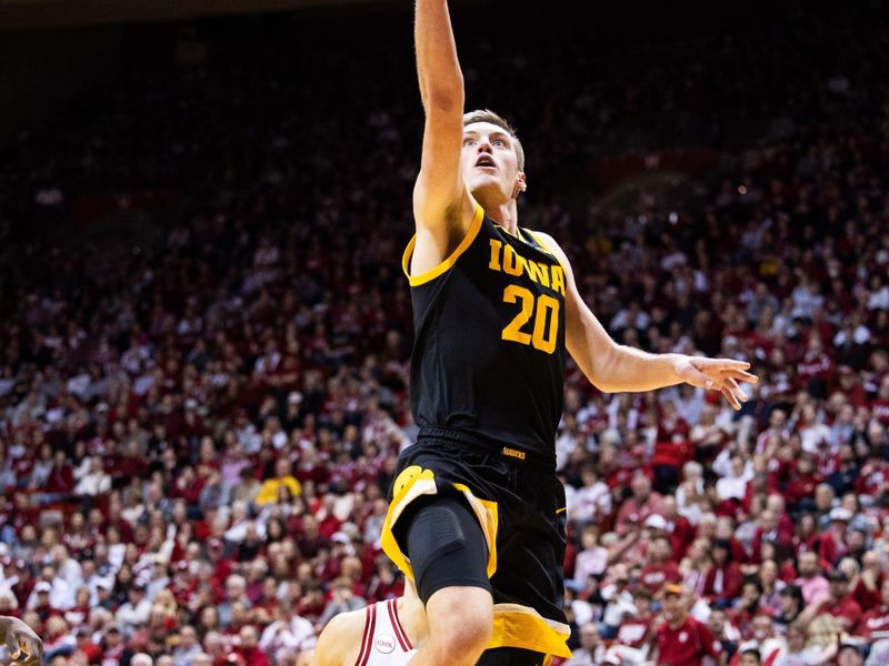 Jan 30, 2024; Bloomington, Indiana, USA; Iowa Hawkeyes forward Payton Sandfort (20) shoots the ball in the second half against the Indiana Hoosiers at Simon Skjodt Assembly Hall. Mandatory Credit: Trevor Ruszkowski-USA TODAY Sports