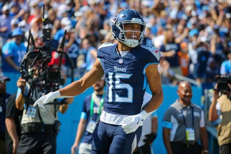 Tennessee Titans wide receiver Nick Westbrook-Ikhine (15) celebrates a touchdown during the first half of an NFL football game against the Indianapolis Colts, Sunday, Oct. 13, 2024, in Nashville, Tenn. (AP Photo/Stew Milne)