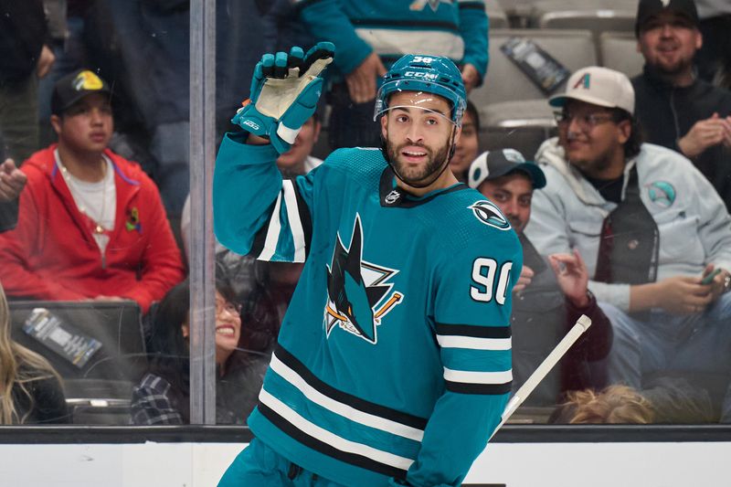 Dec 12, 2023; San Jose, California, USA; San Jose Sharks right wing Justin Bailey (90) acknowledges the crowd after scoring a goal against the Winnipeg Jets during the first period at SAP Center at San Jose. Mandatory Credit: Robert Edwards-USA TODAY Sports