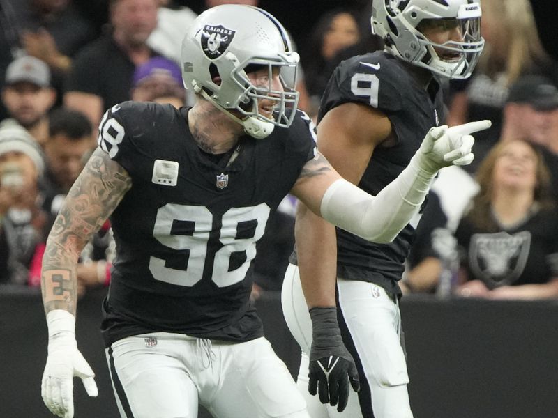 Las Vegas Raiders defensive end Maxx Crosby (98) celebrates after a sack against the Minnesota Vikings during the first half of an NFL football game, Sunday, Dec. 10, 2023, in Las Vegas. (AP Photo/Rick Scuteri)