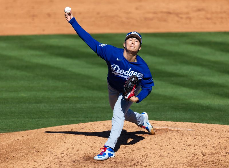 Feb 21, 2026; Tempe, Arizona, USA; Los Angeles Dodgers pitcher Yoshinobu Yamamoto against the Los Angeles Angels during a spring training game at Tempe Diablo Stadium. Mandatory Credit: Mark J. Rebilas-Imagn Images