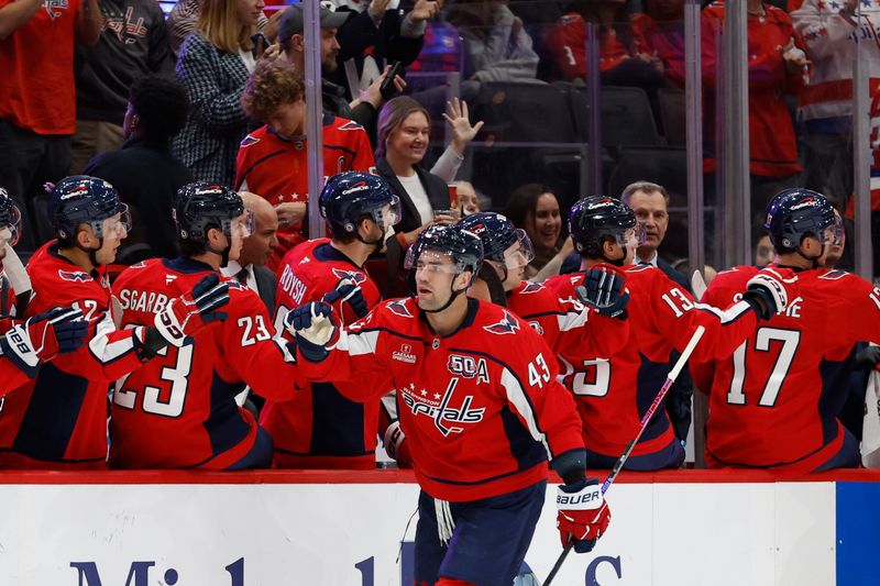 Oct 31, 2024; Washington, District of Columbia, USA; Washington Capitals right wing Tom Wilson (43) celebrates with teammates after scoring a goal against the Montreal Canadiens in the second period at Capital One Arena. Mandatory Credit: Geoff Burke-Imagn Images