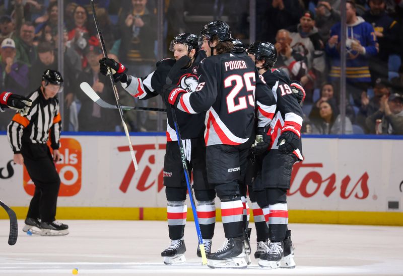 Mar 2, 2024; Buffalo, New York, USA;  Buffalo Sabres defenseman Owen Power (25) celebrates his goal with teammates during the third period against the Vegas Golden Knights at KeyBank Center. Mandatory Credit: Timothy T. Ludwig-USA TODAY Sports